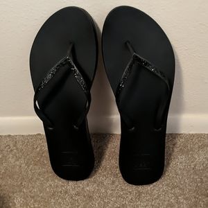Reef sparkle black flip flops